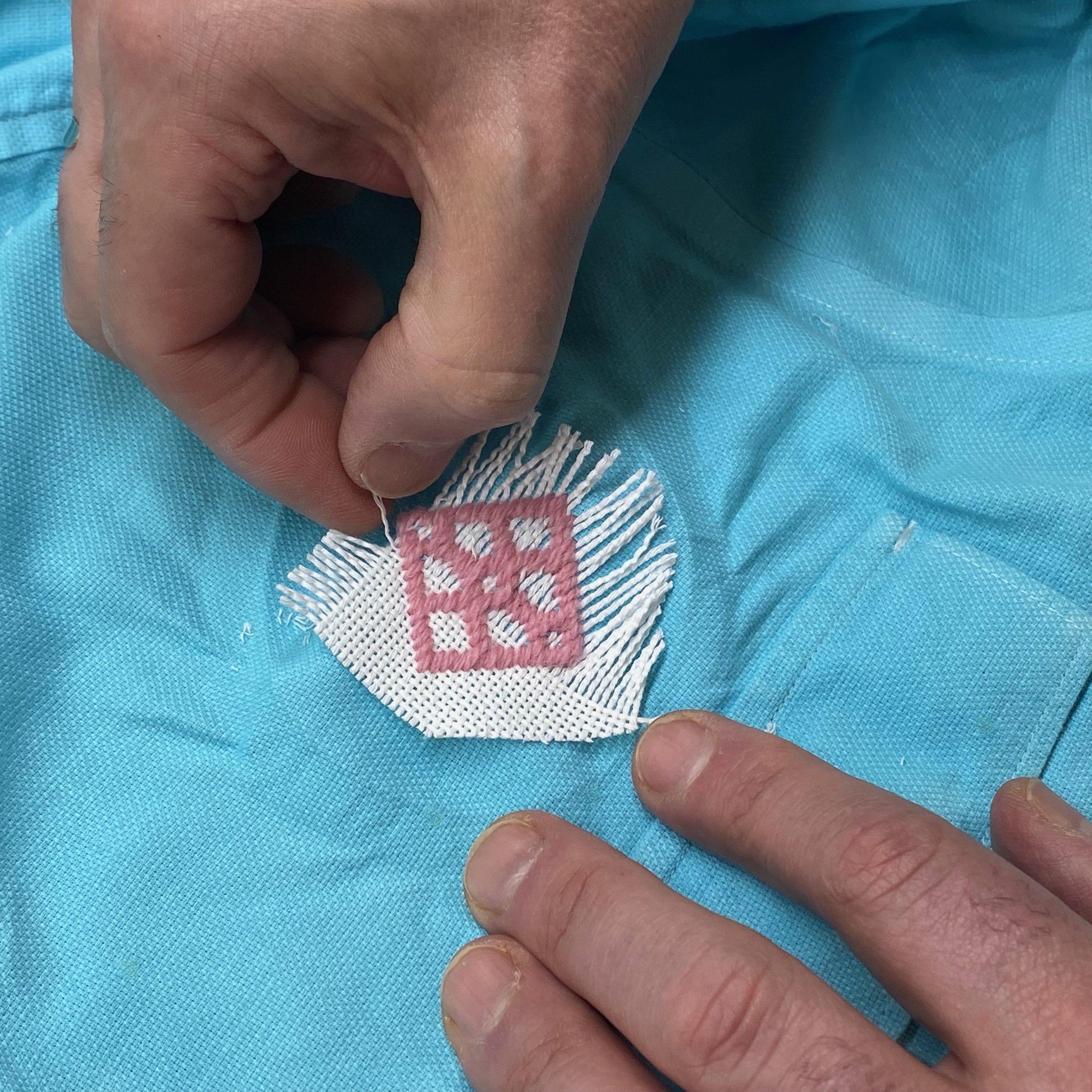pulling threads once motif is stitched