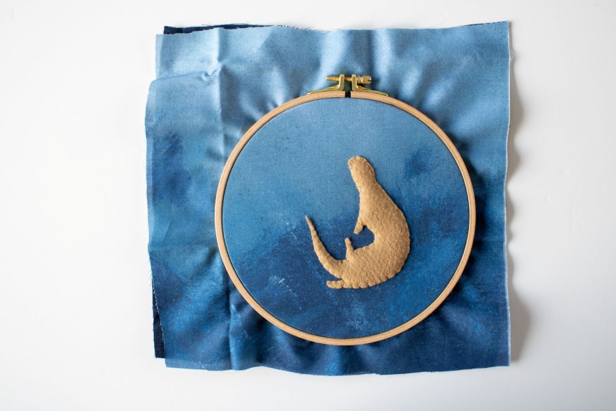 Felt padding stitched to a fabric base, ready to be embroidered