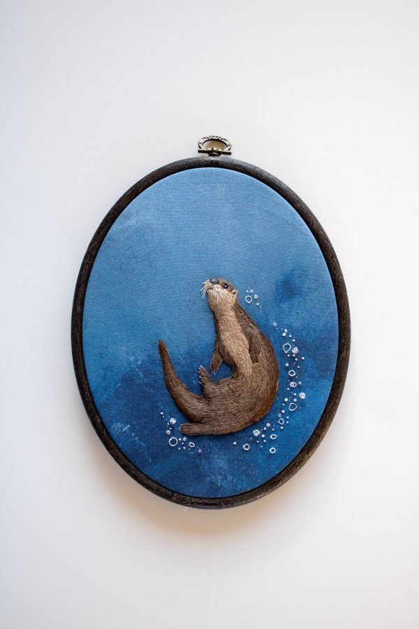 The finished stumpwork river otter embroidered over the padded base
