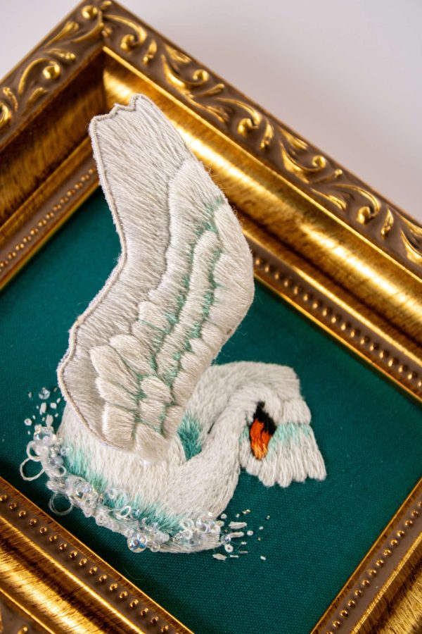 Surface beading is used to mimic bubbles and add sparkle to this stumpwork swan design
